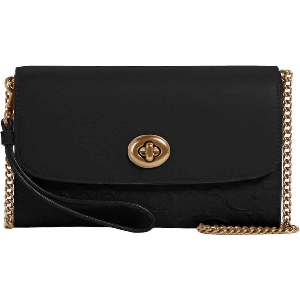 Bandolera de cuero Coach con cierre giratorio y compartimentos múltiples. Bandolera de cuero Coach con cierre giratorio y compartimentos múltiples.