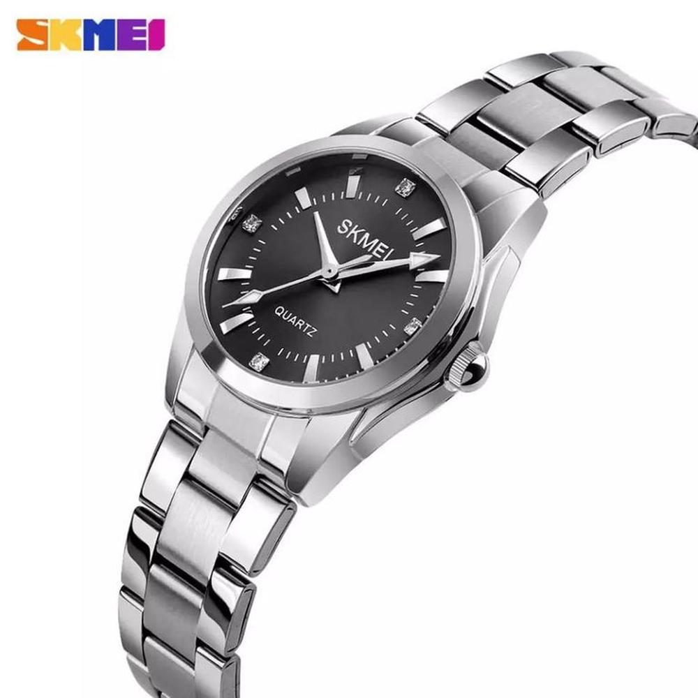 RELOJ SKMEI 1620 PLATEADO FONDO NEGRO CORREA ACERO PARA MUJER.