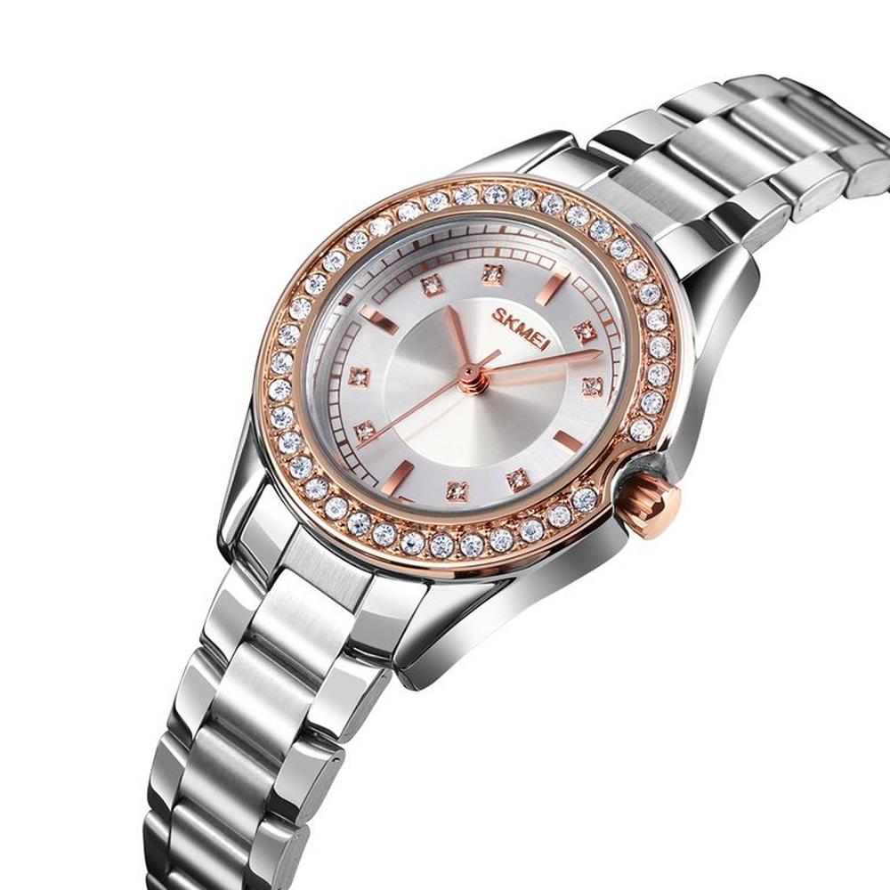 RELOJ SKMEI 1534 PLATEADO DETALLES ORO ROSA CORREA ACERO PARA MUJER