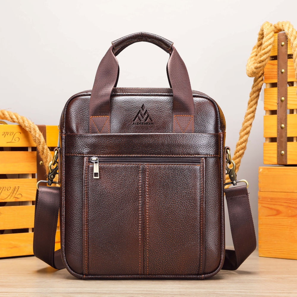 Morral De Cuero Vacuno 8577 Aldebarán. Amplica capacidad laptop 13. Café